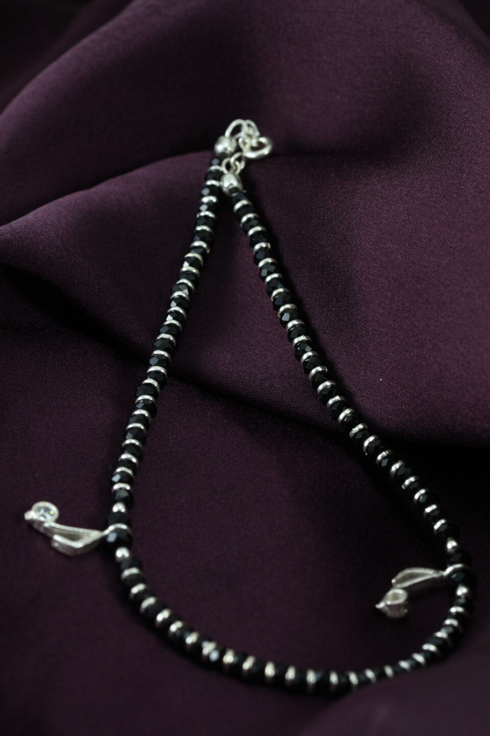 silver anklets with black beads